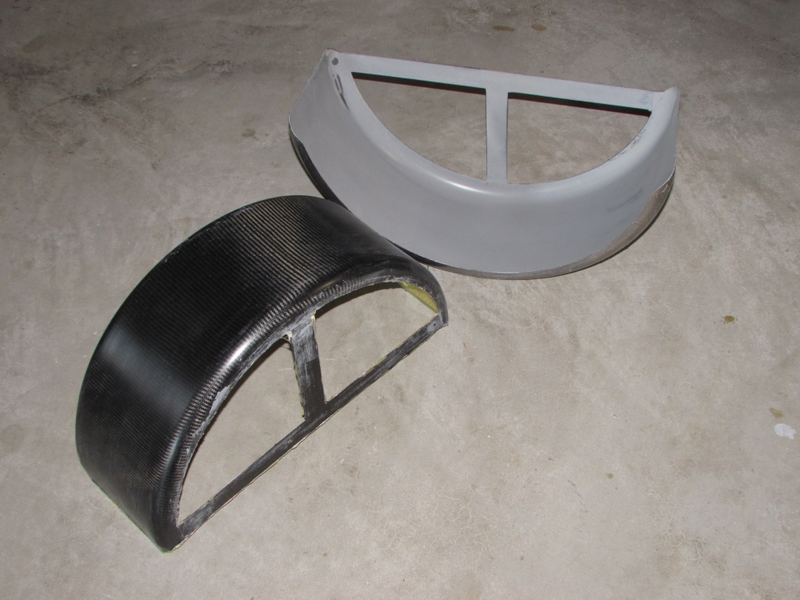 Frecks used a steel trailer fender (right) as the model for his carbon fiber fenders (left).